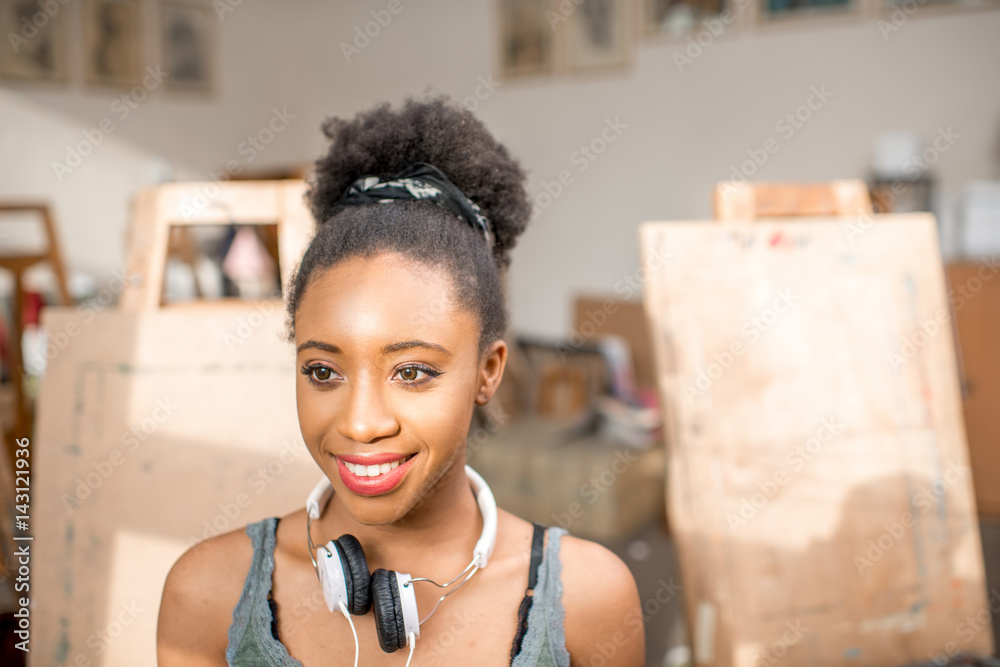 Portrait of a young african ethnicity student at the university studio for painting