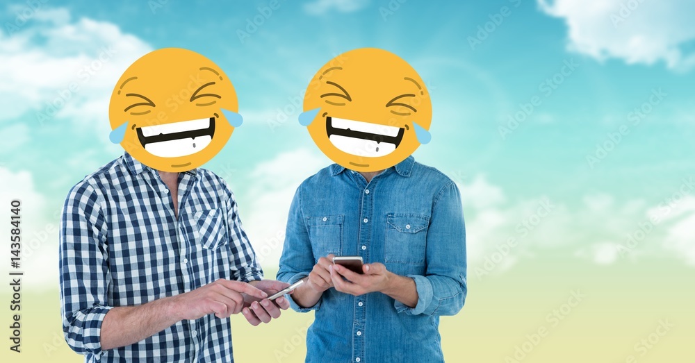 Friends with emojis on faces using smartphones