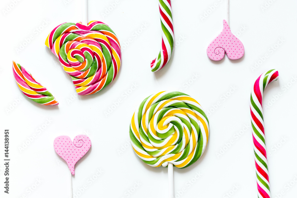 Colorful candies on white background top view mock up