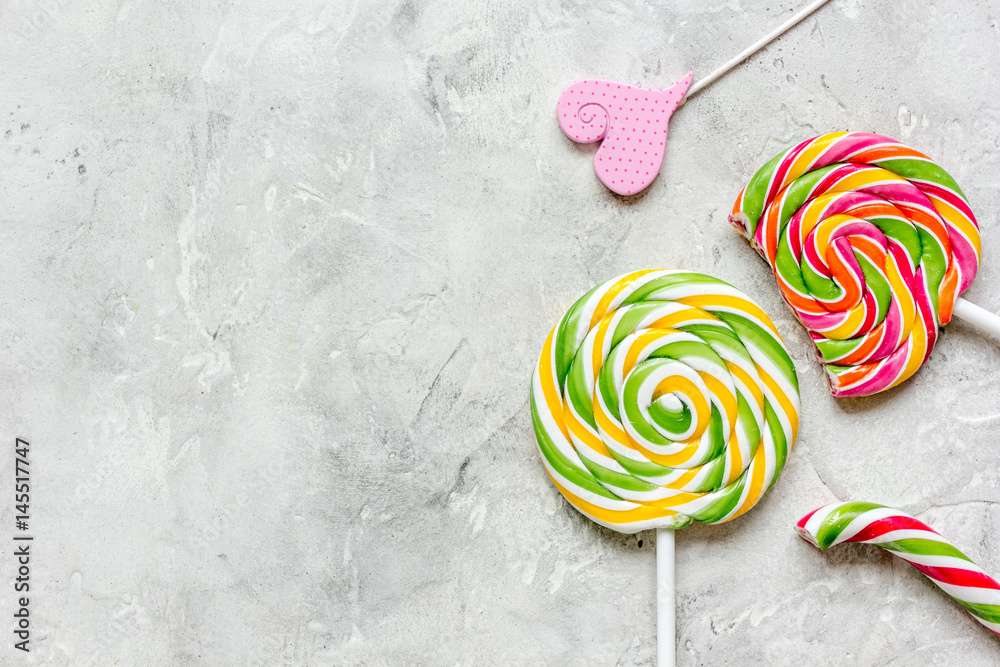 lollipop design with sugar candys on gray background top view mockup