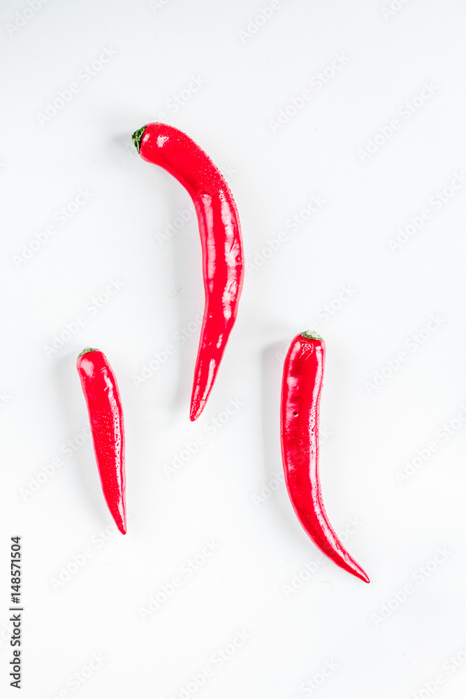 red chili pepper design on white table background top view mock-up