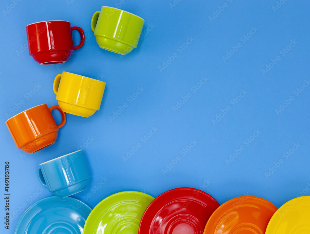 colorful four coffee cups on blue background.
