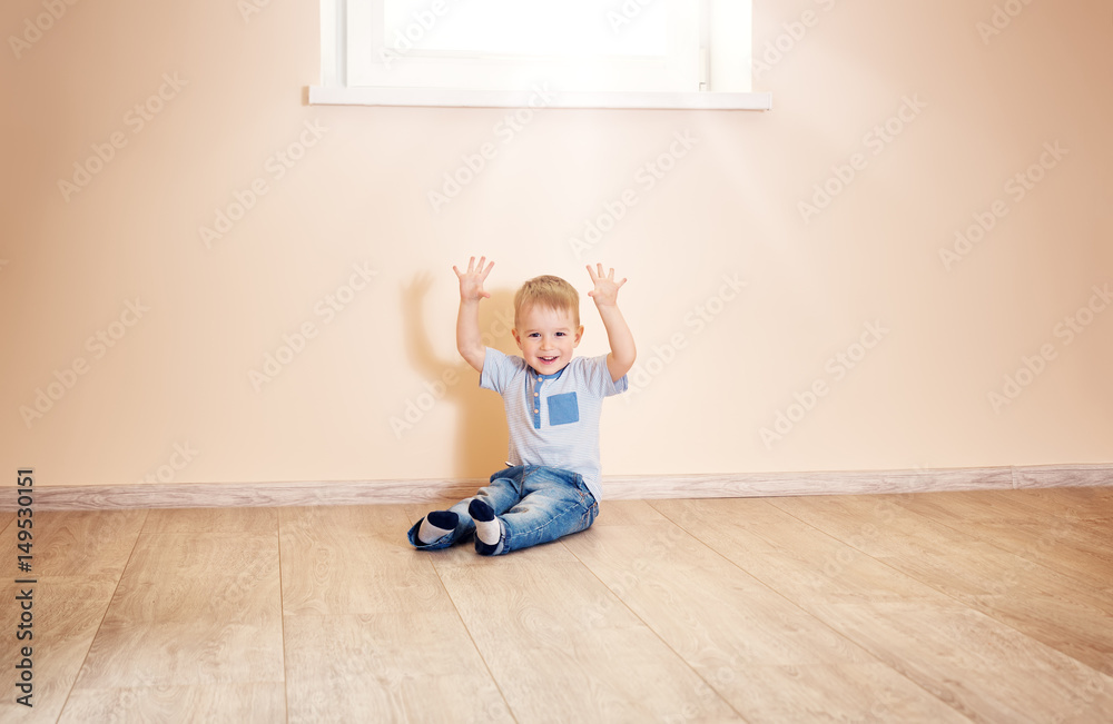 Portrait of a two years old child sitting on the floor