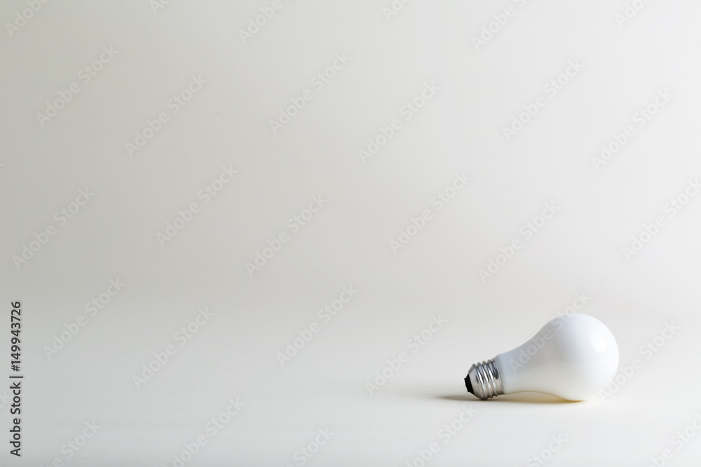 Colored lightbulb on a white background