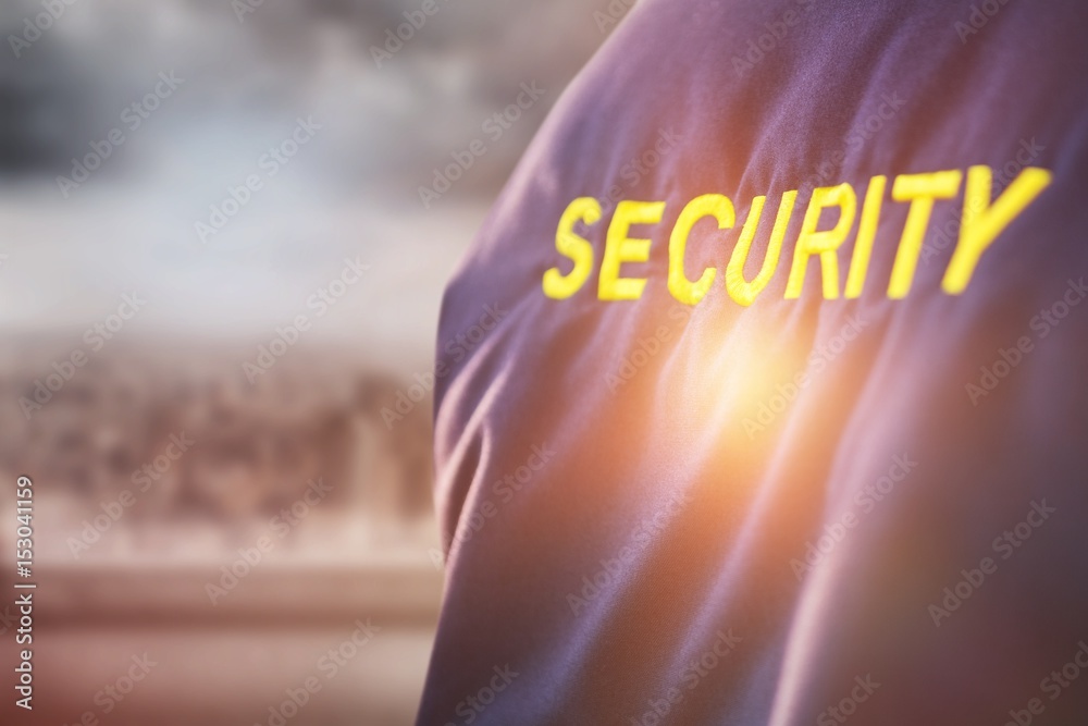 Composite image of security text on uniform