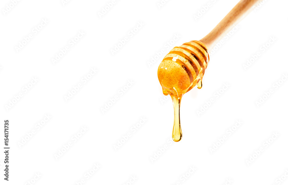 白底木勺上的蜂蜜