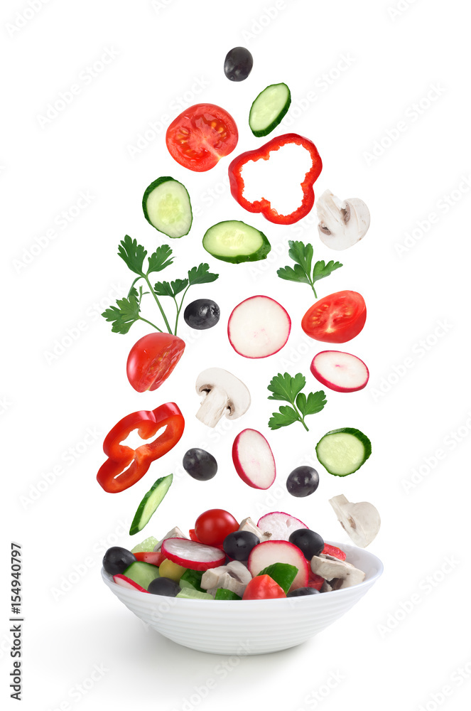 flying salad in plate isolated on white