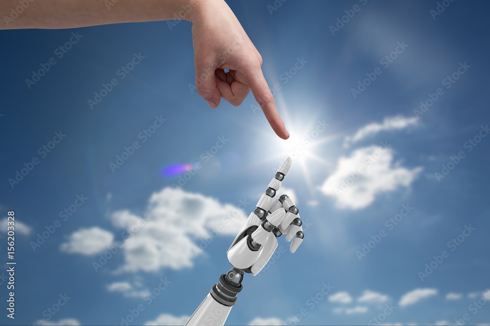human hand is touching robot hand against sky background 