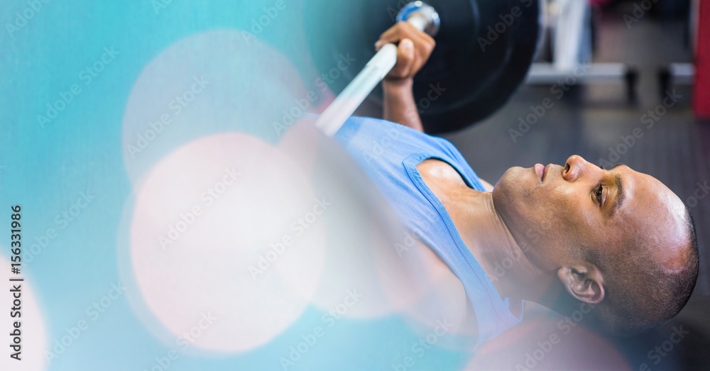 Man on ground weightlifting and blue bokeh transition