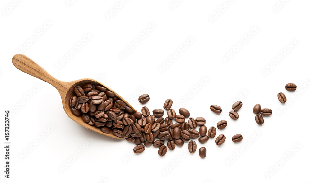 Coffee beans on wooden scoop isolated on white background