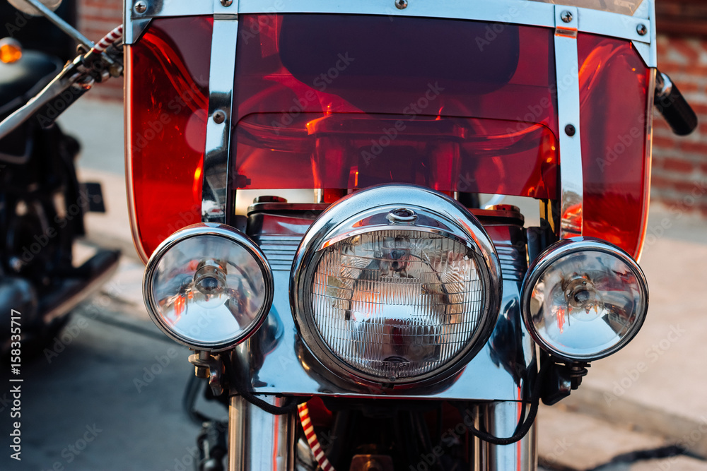 Close-up view on retro motorcycle headlights.