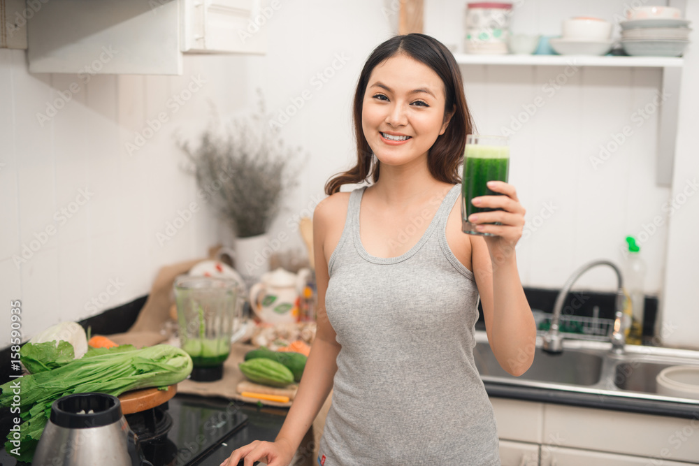 Young asian woman enjoy healthy vegetarian smoothie for weight loss and detox