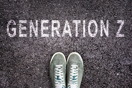 Text Generation Z written on asphalt with shoes, generation Z concept