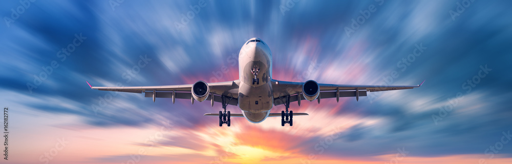 Airplane with motion blur effect. Landscape with passenger airplane is flying in the blue sky with b