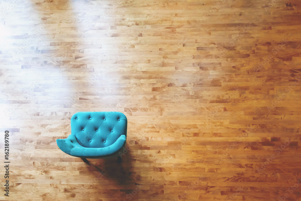 Overhead view of a turquoise chair in a large luxury home