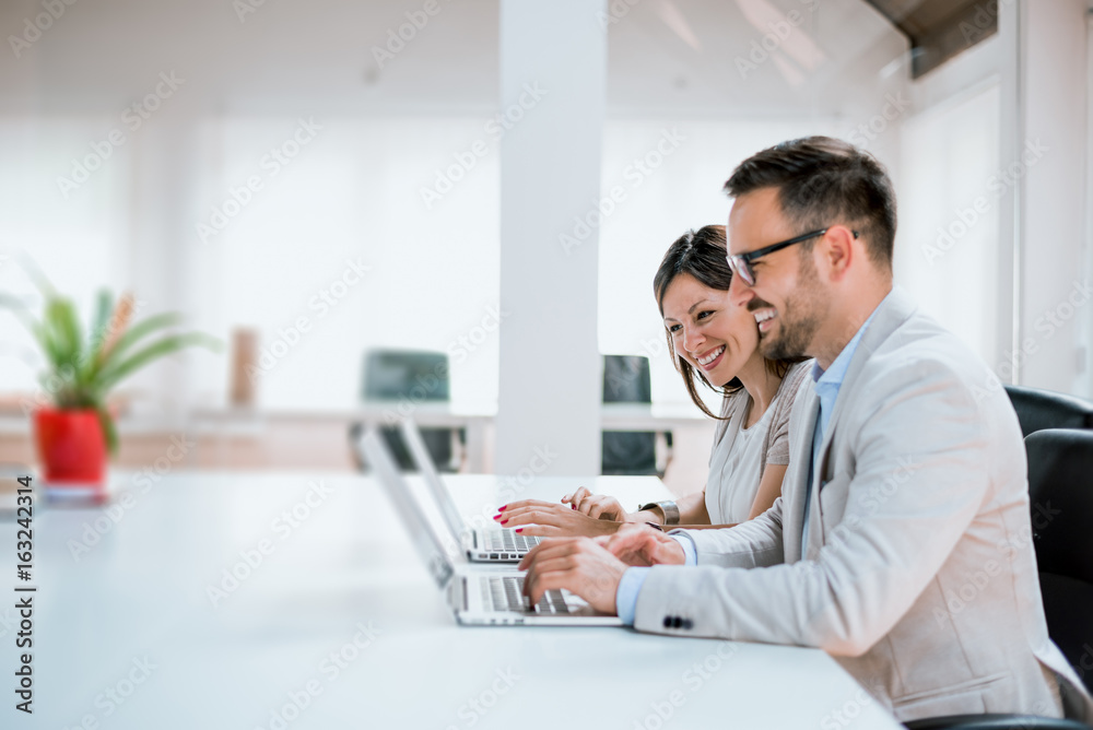 Image of two successful business partners working in the office