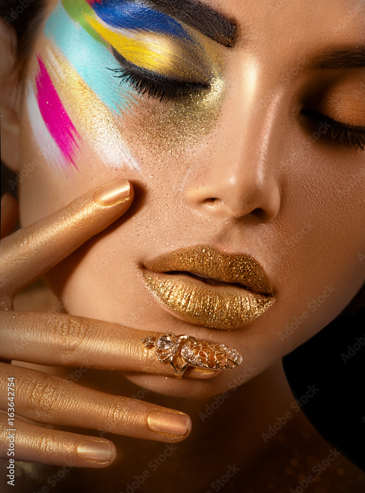 Beauty fashion art portrait of beautiful woman with colorful abstract makeup