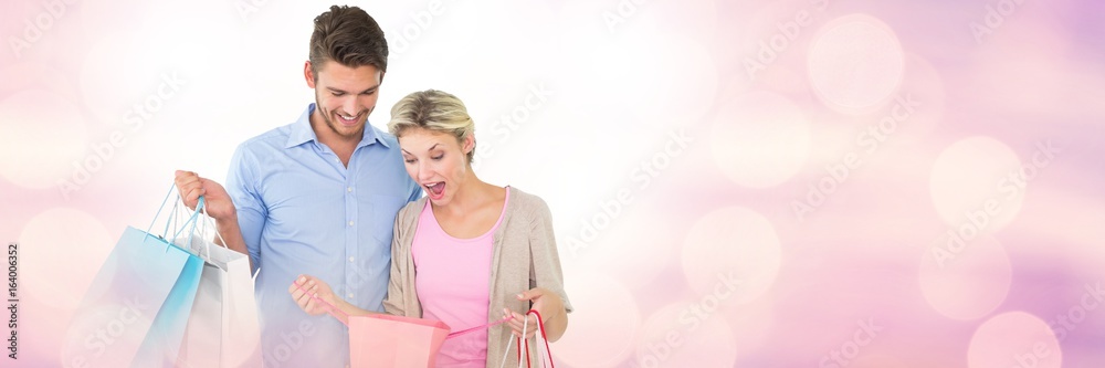 Couple shopping with bags and sparkling lights bokeh transition