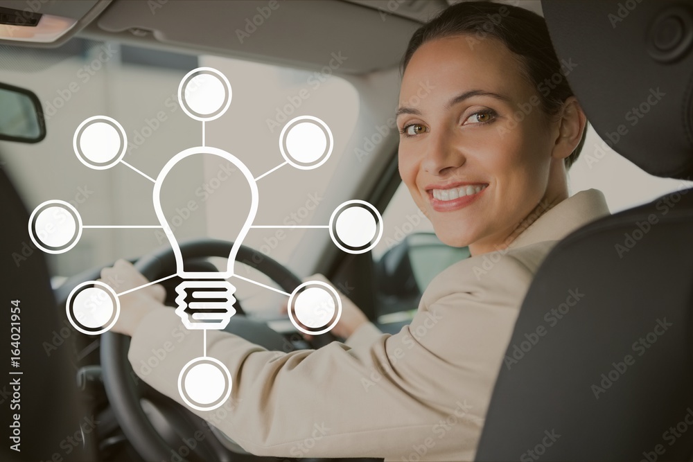 Bulb icon against woman driving photo