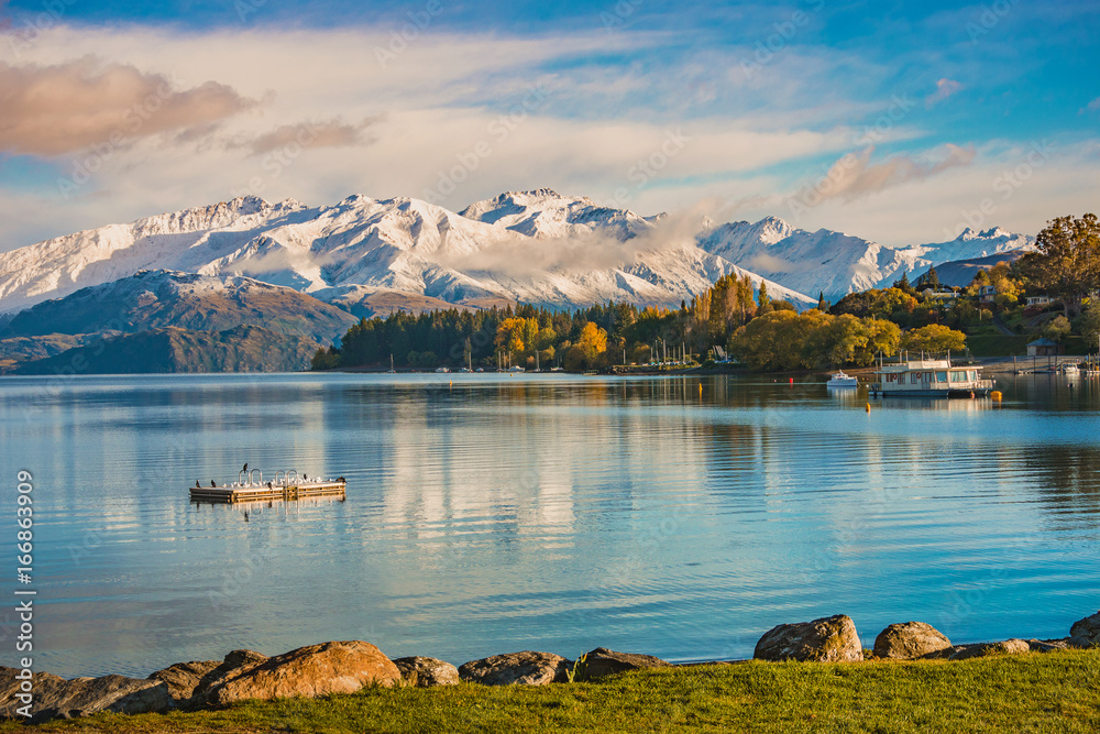 Morning snow at lakeside of Wanaka, south island, New Zealand with a view of snow mountain, colorful