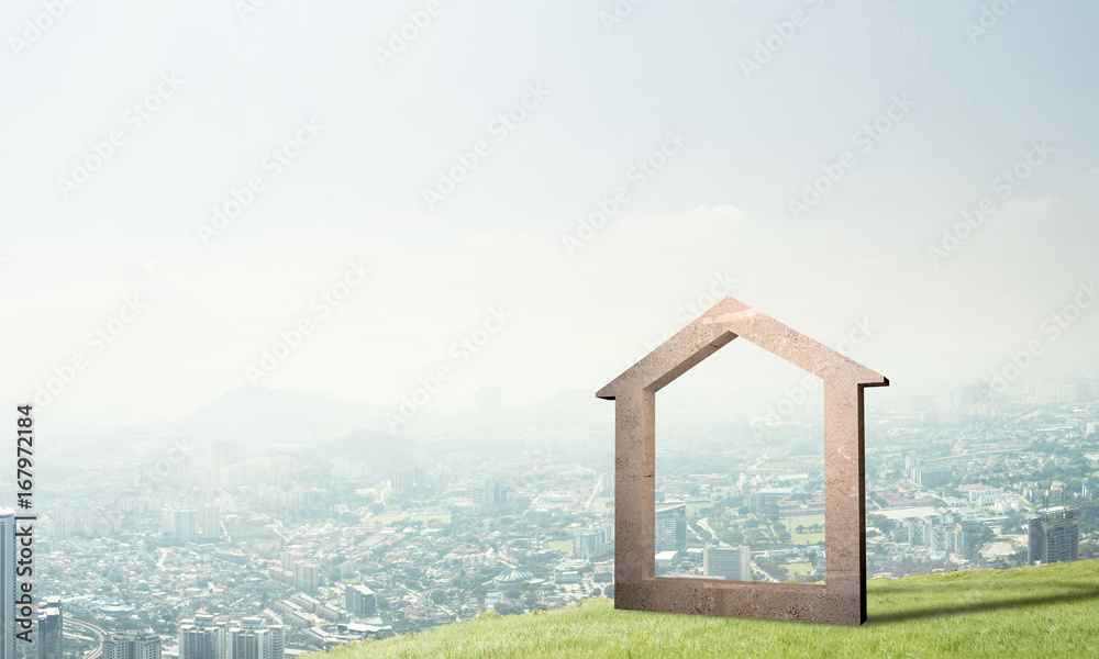 山丘上的混凝土住宅标志和背景自然景观的概念图