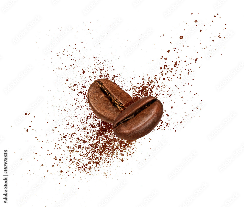 Two coffee beans collide in the air on white background