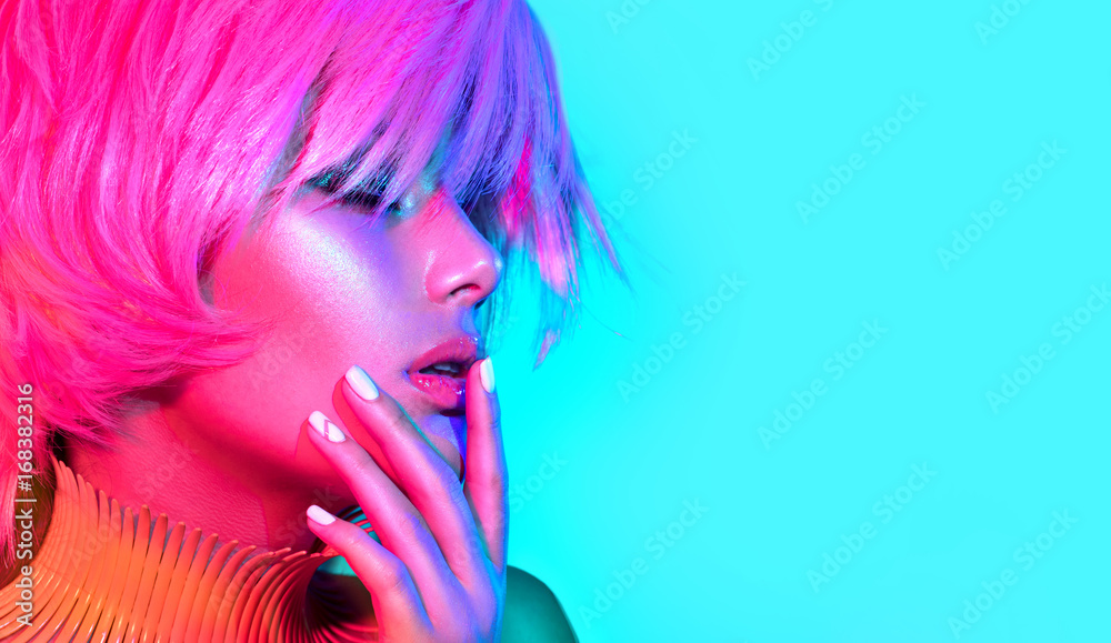 Fashion model woman in colorful bright lights, portrait of beautiful party girl with trendy makeup, 