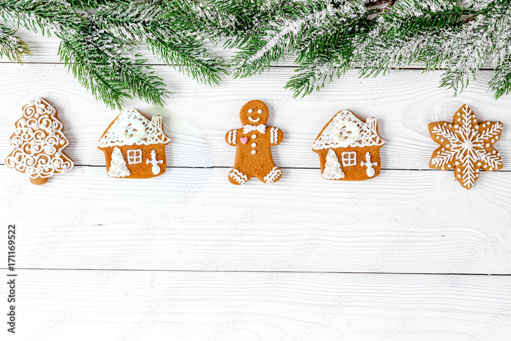 Christmas gingerbread, spruce branches on wooden background top 