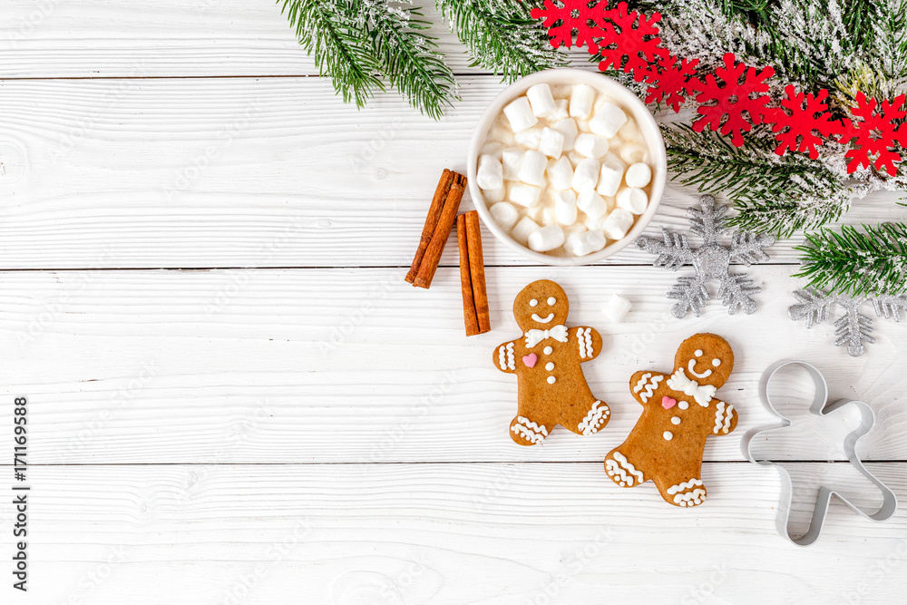 Christmas gingerbread, spruce branches on wooden background top 