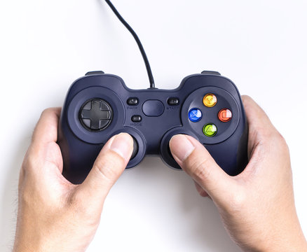 Hand holding playing on video game Joystick joypad