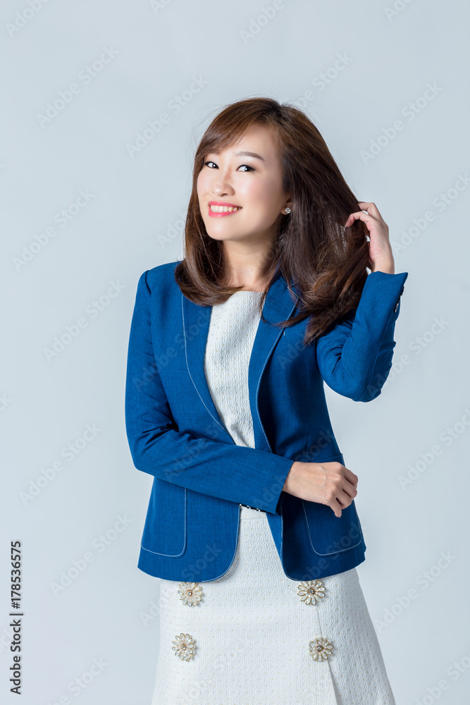 asian woman in blue suit happiness action pose in studio isolate white background
