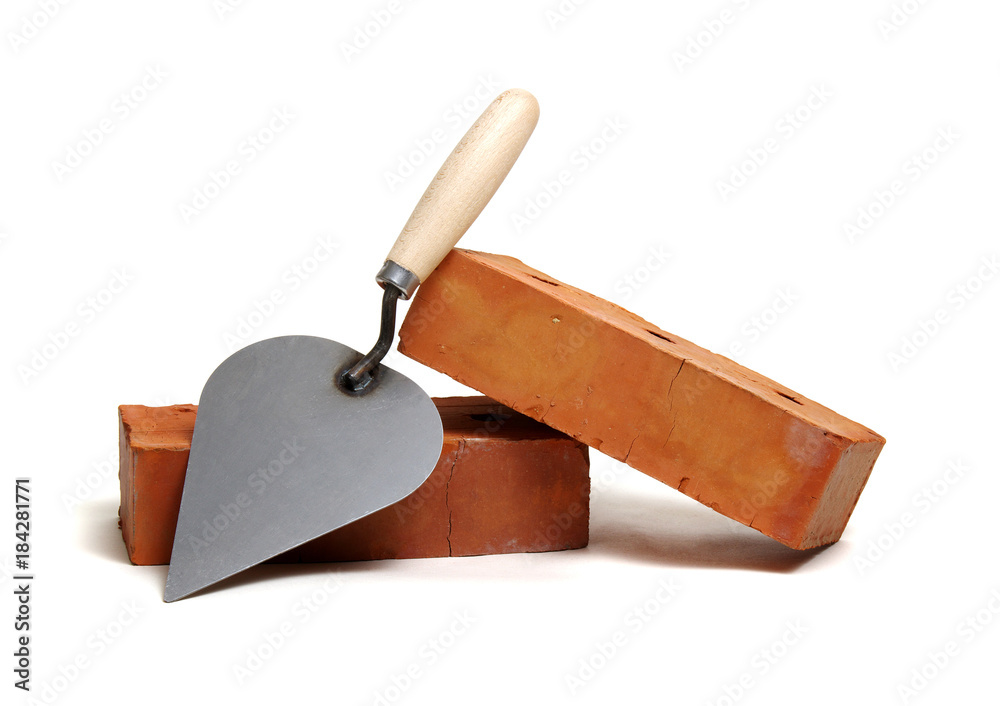 Brick and trowel on a white