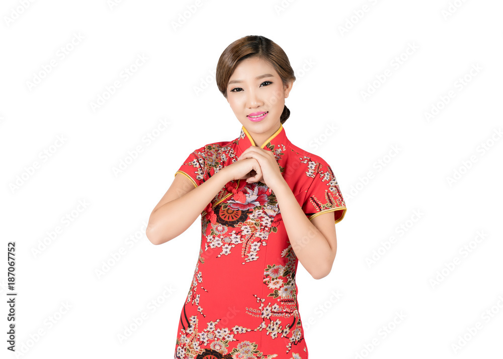 亚洲女人穿着中国传统的中国服装，在中国新年里表示祝贺