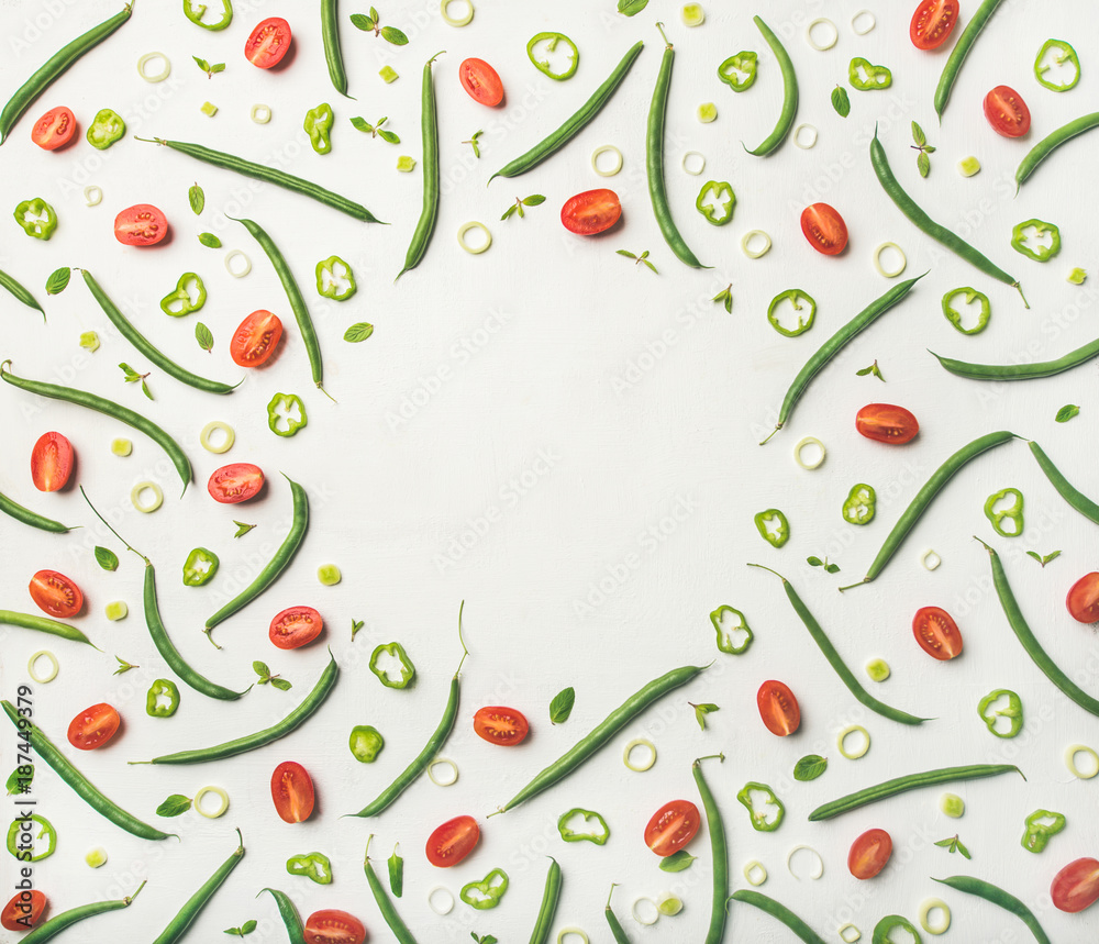 Food frame, pattern, texture and background. Flat-lay of fresh vegetable slices over white wooden ba