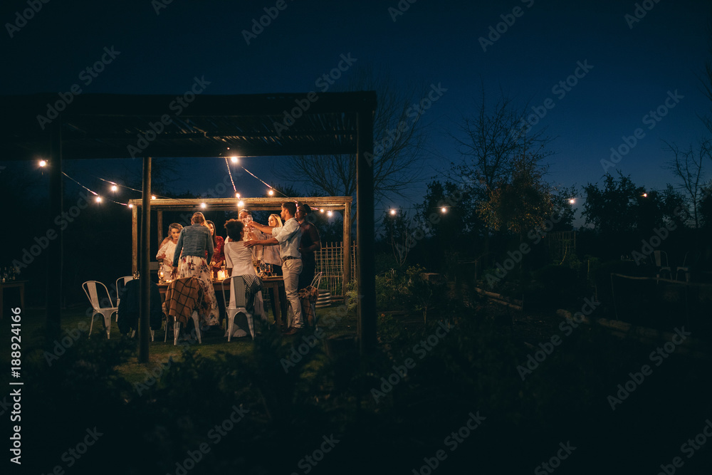 Group of people having a party at night