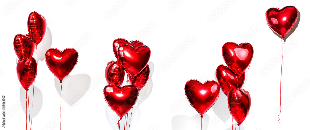情人节。一组气球。一束红色心形箔气球隔离在白色背上