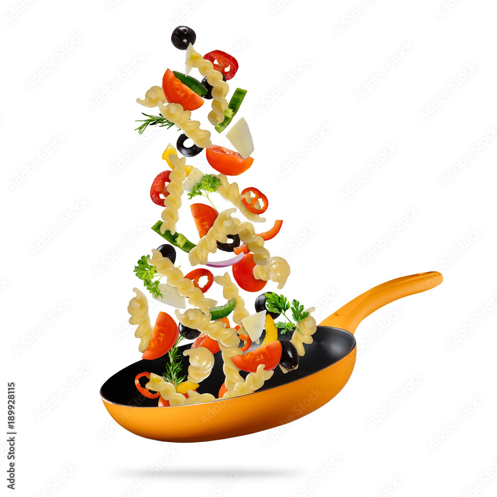Concept of flying food preparation of pasta and vegetable in pan.