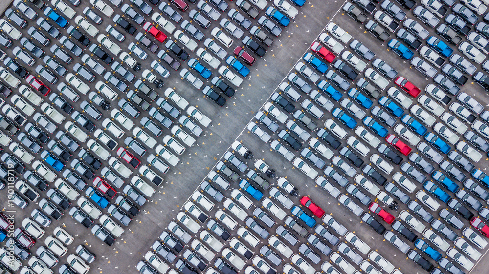 Aerial view new car lined up in the port for dealership business import and export, New car lined up