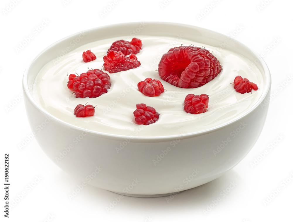 bowl of yogurt cream with raspberries