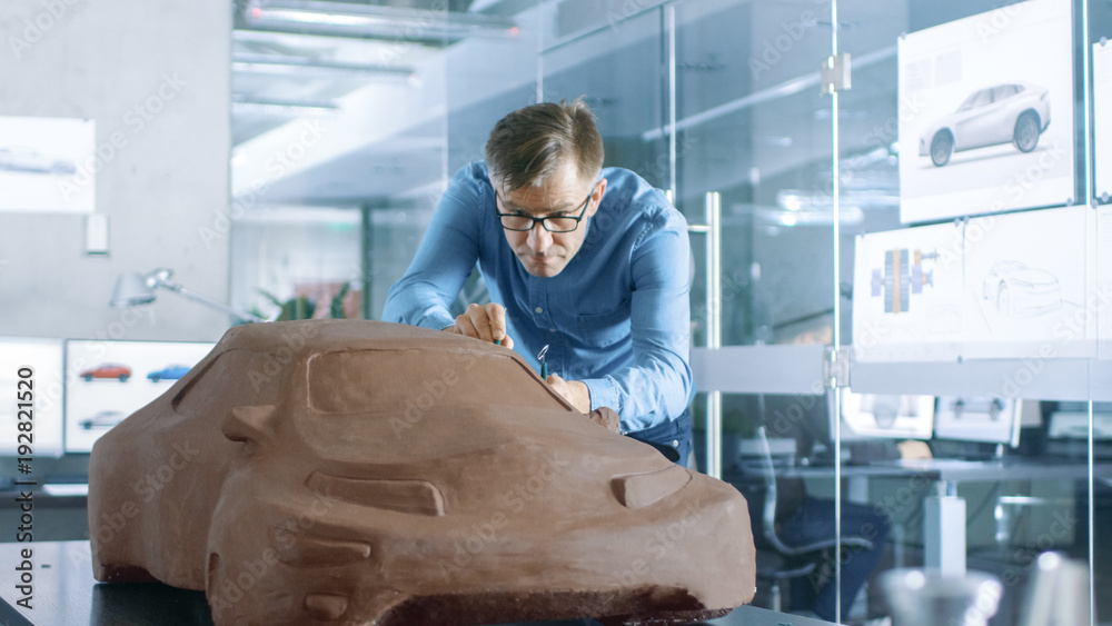 Experience Automotive Designer with a Rake Sculpts Prototype Car Model from Plasticine Clay. He Work