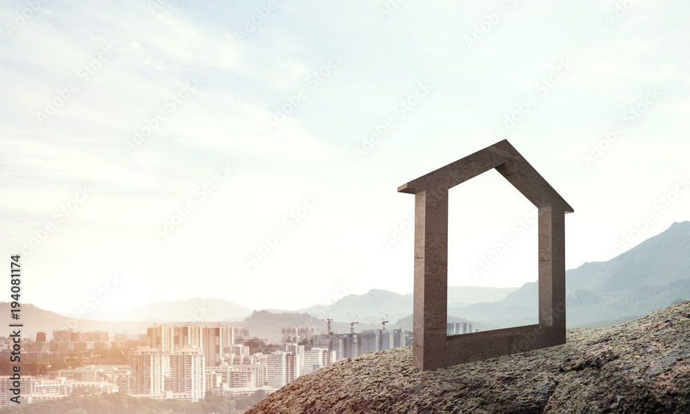 山丘上的混凝土住宅标志和背景的自然景观的概念图像