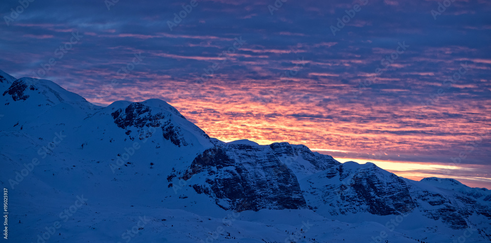Beautiful sunset over Alpine mountains in winter