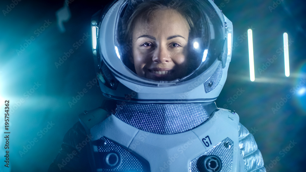 Portrait of the Beautiful Female Astronaut on the Alien Planet Looking around in Wonder, Smiles. In 