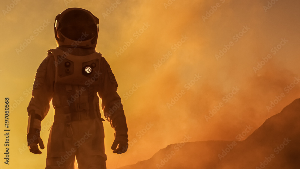 勇敢的宇航员自信地行走在火星表面。这颗红色星球被气体和岩石覆盖，克服了D