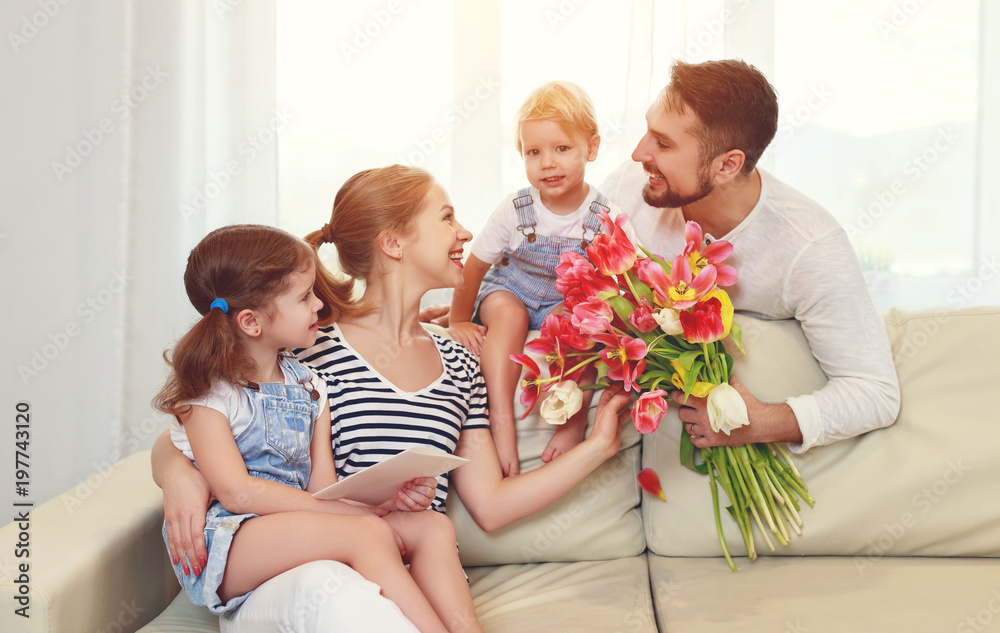 happy mothers day! father and children congratulate mother on holiday