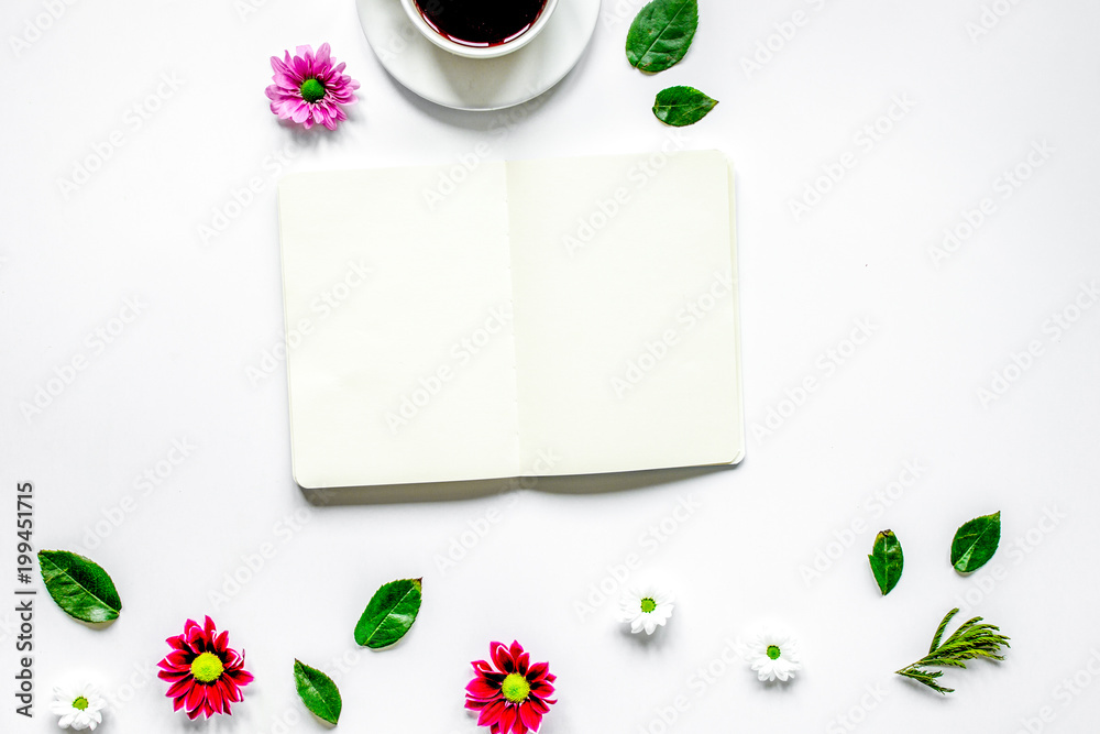 Copybook, americano and flowers on white table top view mock-up