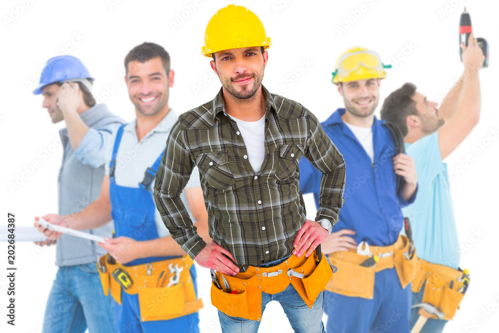 Composite image of handyman wearing tool belt with hands on hips