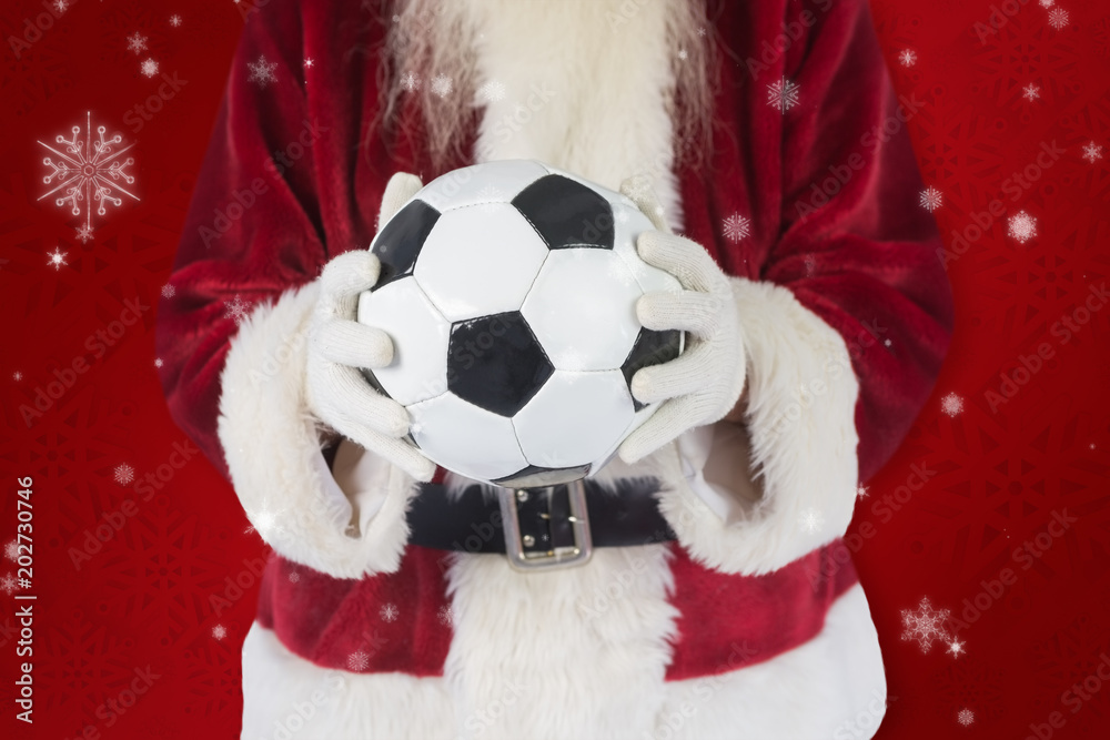 圣诞老人在红色雪花背景下手持经典足球