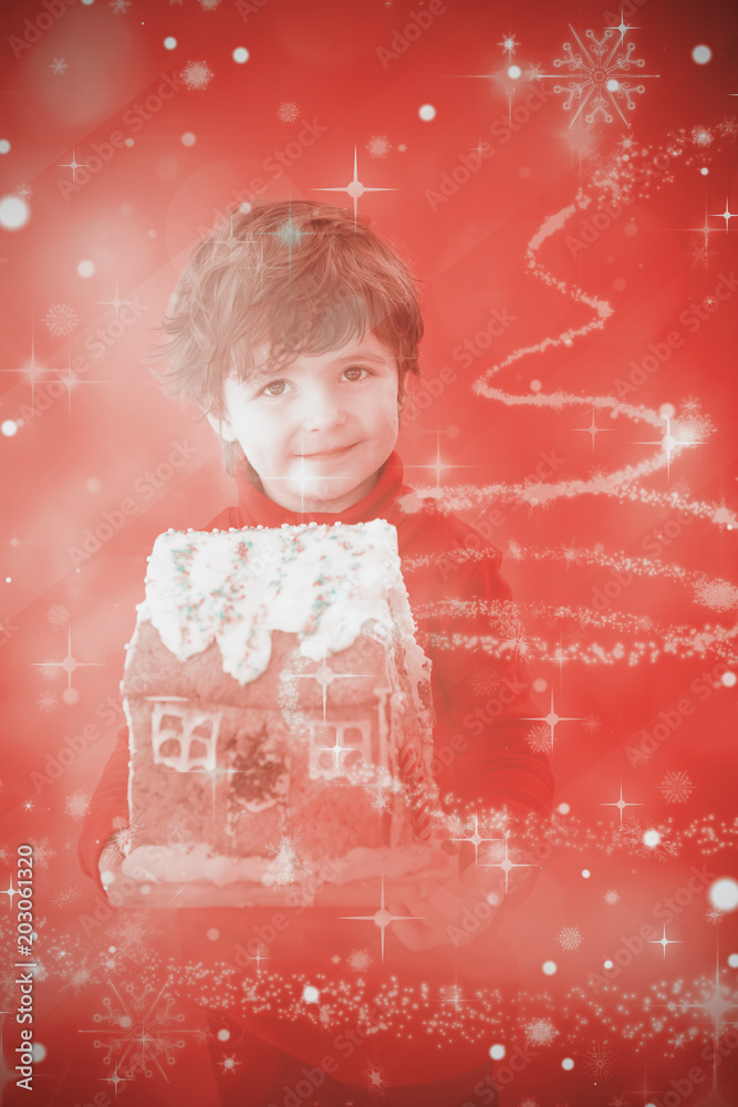 节日小男孩拿着姜饼屋，对着闪闪发光的圣诞树设计
