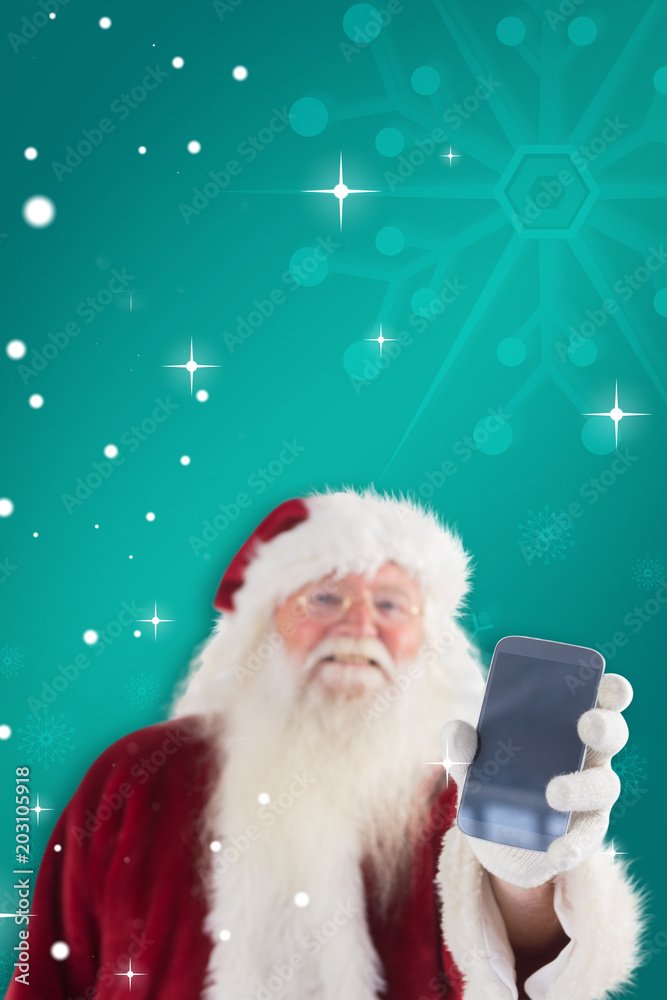 圣诞老人在绿色雪花背景下展示智能手机